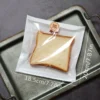 a0478264-34ed-11ef-89de-0a580a6610a4.webp 100pcs Clear Plastic Half-Wrap Bread Bags with Kraft Paper Stickers (18.3X20CM)